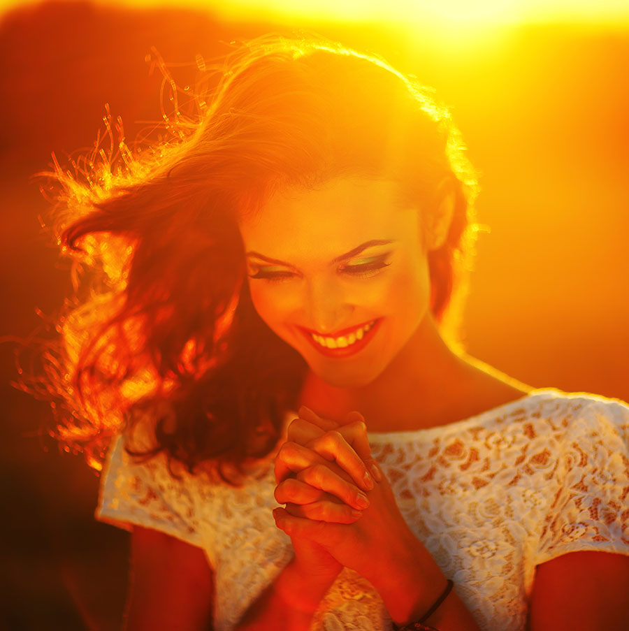 happy woman in golden sunlight