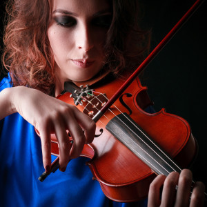 Woman playing violin of hope