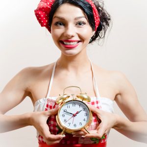 woman holding clock