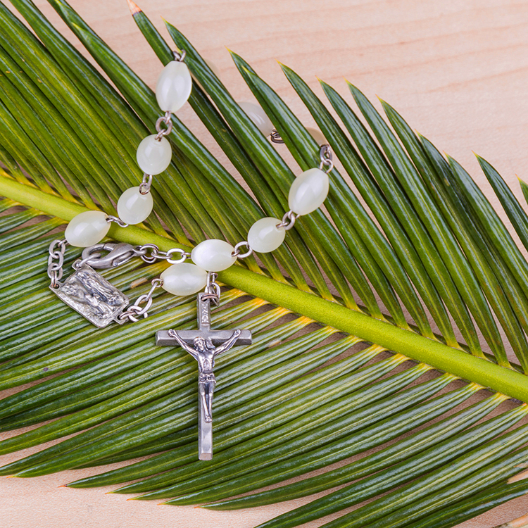 Rosary and palm frond