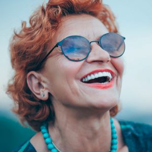 Red head with beaming smile