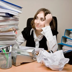 woman with stack of work